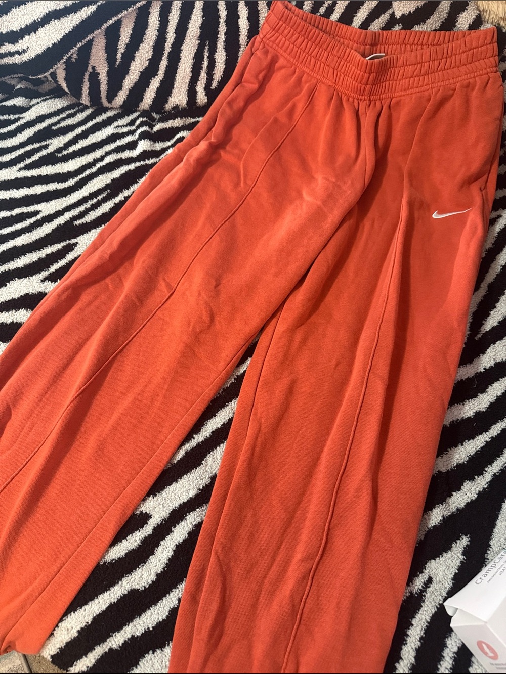 Nike Orange Lounge Sweatpants with White Swoosh